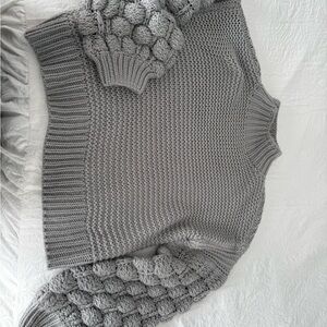 Elegant Gray Turtleneck Sweater with Textured Sleeves